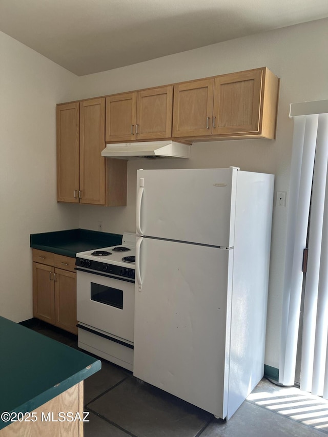 kitchen featuring light brown cabinetry, under cabinet range hood, and white appliances