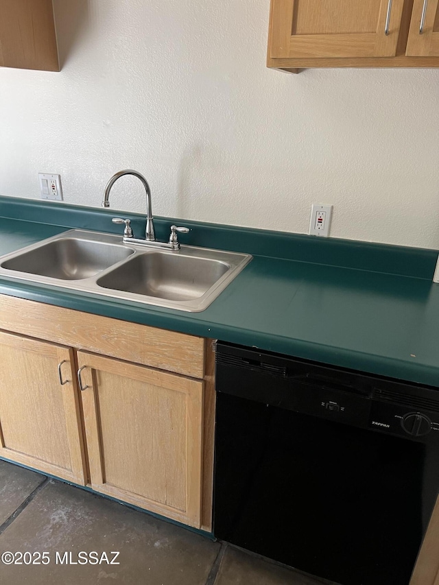 kitchen with a sink, dishwasher, and light brown cabinetry