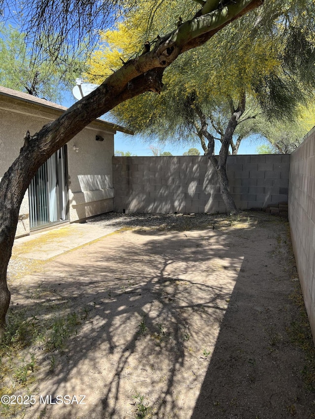 view of yard featuring a patio and a fenced backyard