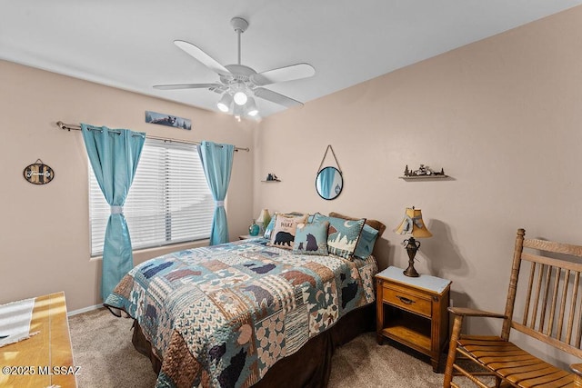 carpeted bedroom with baseboards and ceiling fan