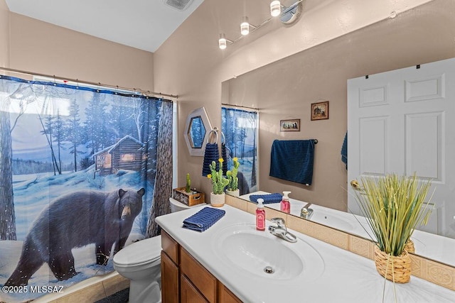 bathroom with vanity and toilet