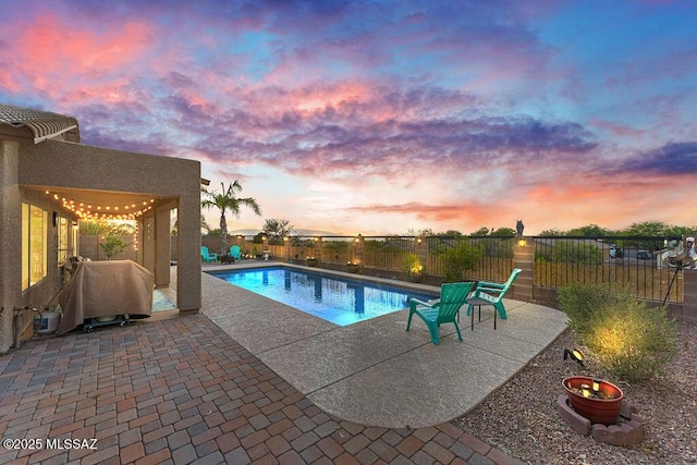 view of pool featuring a fenced in pool, a fenced backyard, and a patio area
