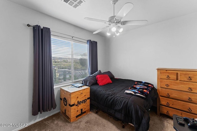 bedroom with visible vents, a ceiling fan, and carpet