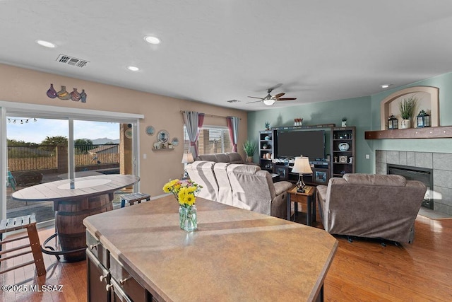 dining area with recessed lighting, ceiling fan, light wood finished floors, and visible vents