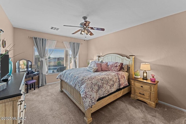 bedroom featuring carpet floors, baseboards, and visible vents