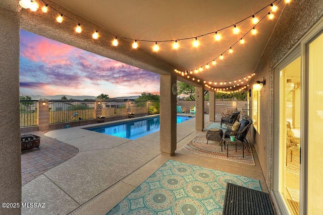 view of pool with a fenced in pool, a fenced backyard, and a patio area