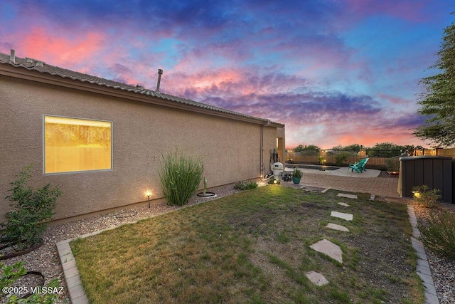 view of yard with fence and a patio