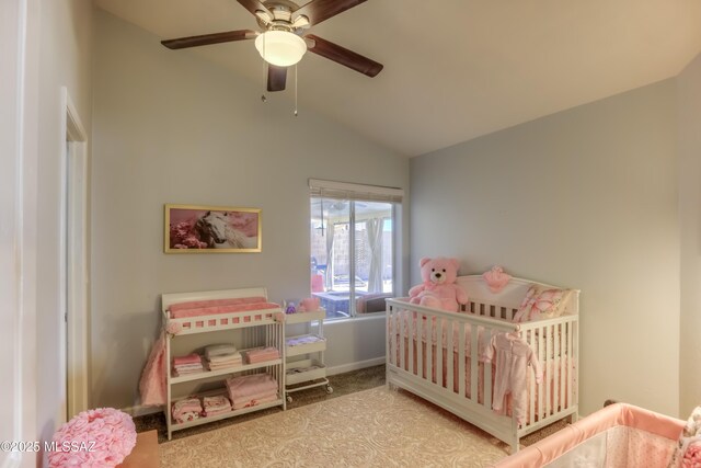 1707 W Sunridge Dr, Tucson, AZ 85704 - carpeted bedroom featuring a nursery area, a ceiling fan, baseboards, and lofted ceiling