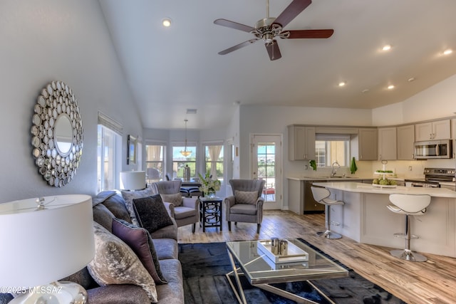 1707 W Sunridge Dr, Tucson, AZ 85704 - living room with high vaulted ceiling, ceiling fan, recessed lighting, and wood finished floors
