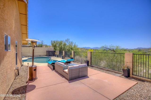 1707 W Sunridge Dr, Tucson, AZ 85704 - view of patio with a fenced backyard, a fenced in pool, and a mountain view
