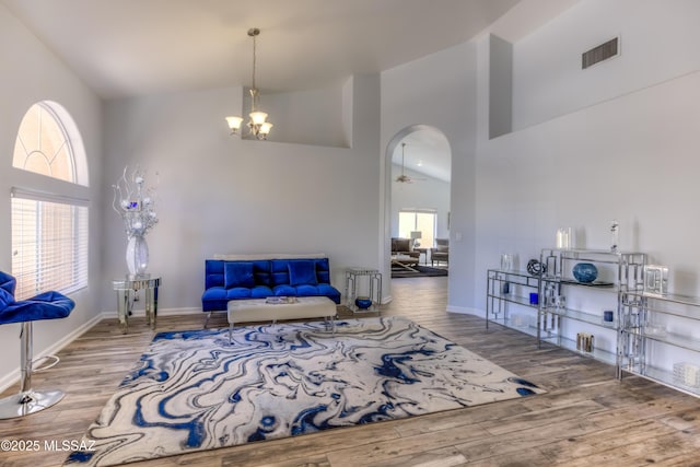 1707 W Sunridge Dr, Tucson, AZ 85704 - living area featuring visible vents, wood finished floors, and high vaulted ceiling