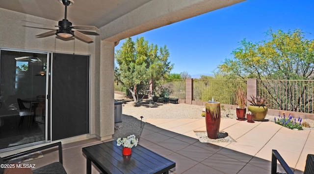 view of patio / terrace with a fenced backyard and ceiling fan