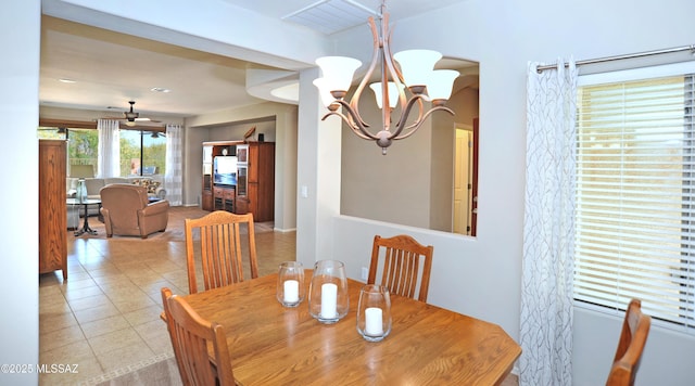 tiled dining room featuring visible vents and a notable chandelier