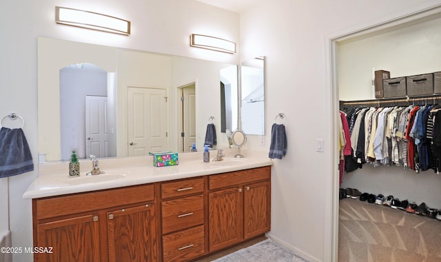 bathroom featuring double vanity and a sink