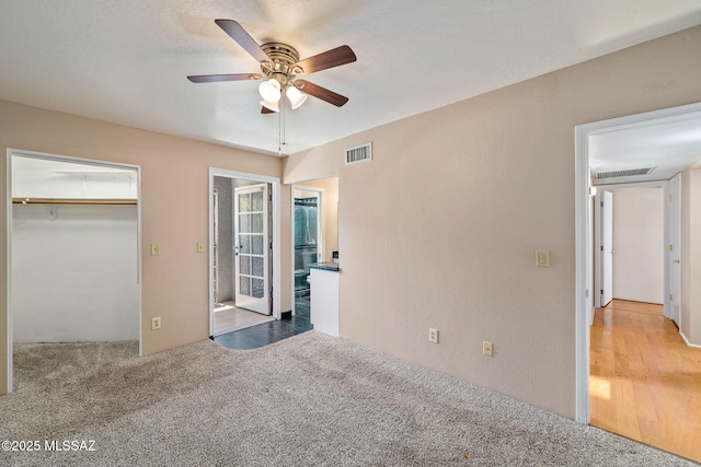 1525 N Bryant Ave, Tucson, AZ 85712 - unfurnished bedroom featuring carpet floors, ceiling fan, and visible vents