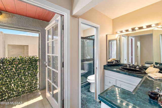 1525 N Bryant Ave, Tucson, AZ 85712 - full bathroom with vanity, an enclosed shower, and toilet