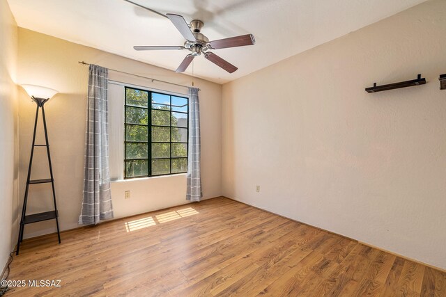 1525 N Bryant Ave, Tucson, AZ 85712 - empty room featuring ceiling fan and wood finished floors