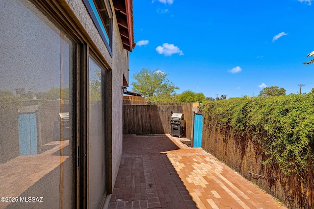 1525 N Bryant Ave, Tucson, AZ 85712 - view of patio with fence and a grill