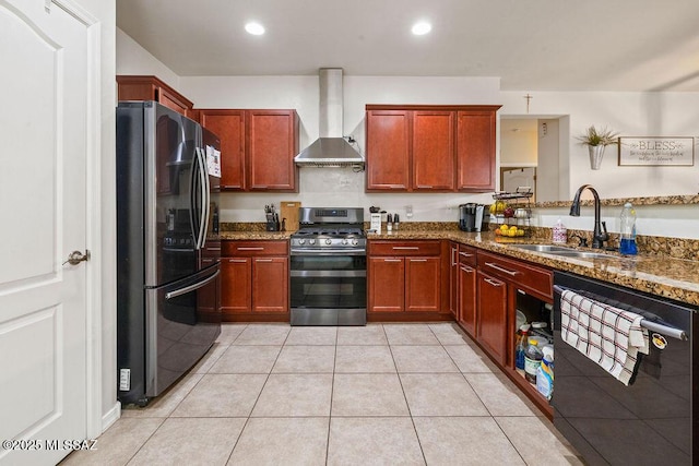 kitchen featuring a sink, wall chimney exhaust hood, dark stone countertops, and stainless steel appliances