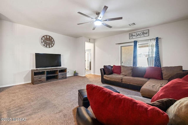carpeted living room featuring ceiling fan, visible vents, and baseboards