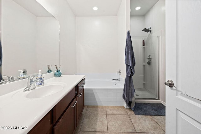 full bath featuring tile patterned flooring, vanity, recessed lighting, a shower stall, and a bath