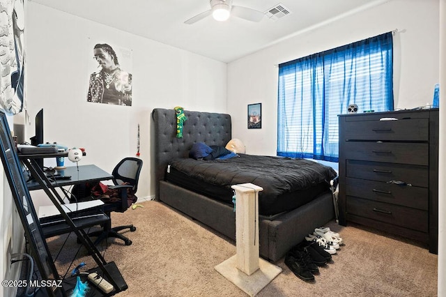 carpeted bedroom featuring ceiling fan and visible vents