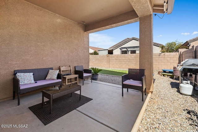 view of patio with a fenced backyard and a grill