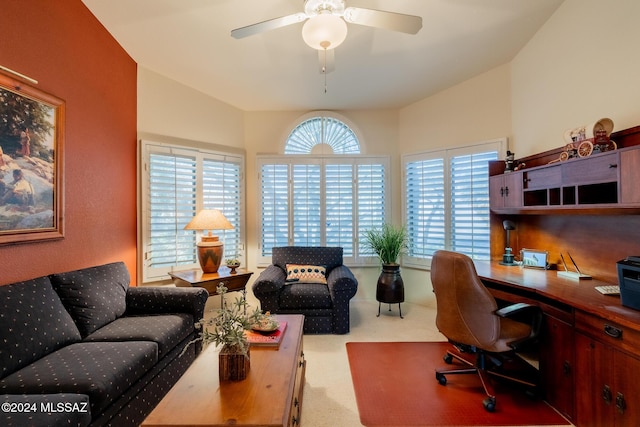 office with carpet floors, a ceiling fan, and lofted ceiling