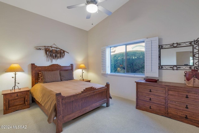 carpeted bedroom with a ceiling fan, high vaulted ceiling, and baseboards