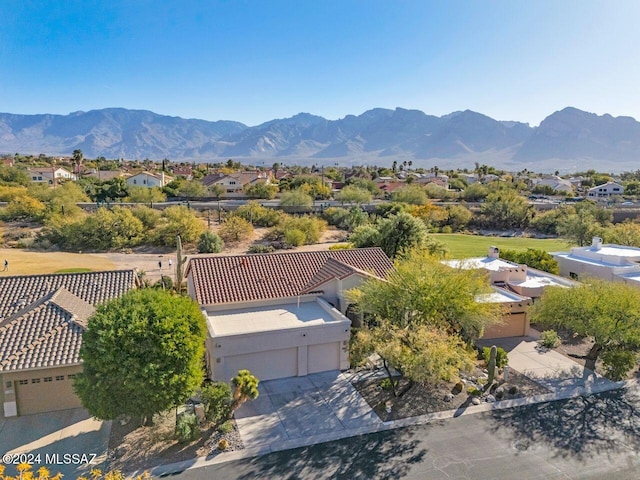 drone / aerial view featuring a residential view and a mountain view