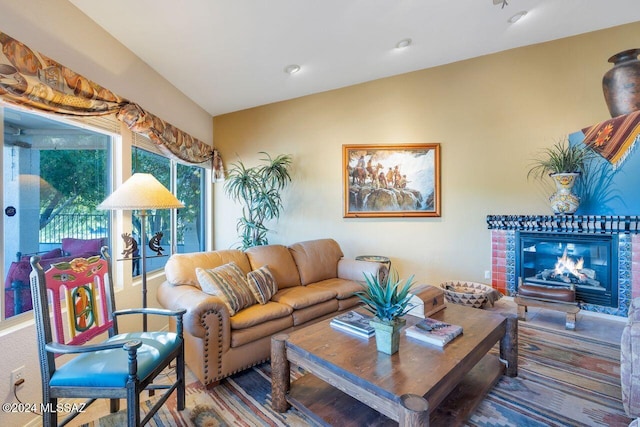 living area with a glass covered fireplace