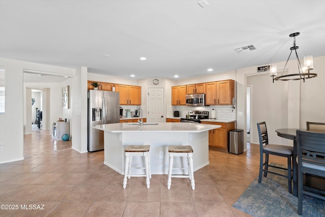 11042 W Case Way, Marana, AZ 85653 - kitchen featuring stainless steel appliances, a sink, a chandelier, light tile patterned flooring, and light countertops