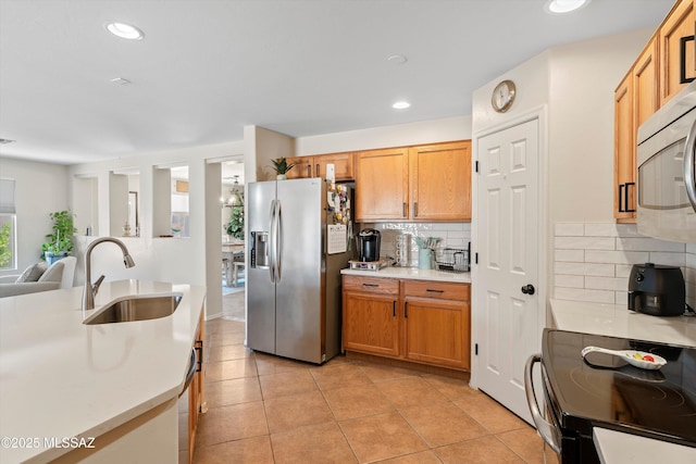 11042 W Case Way, Marana, AZ 85653 - kitchen featuring stainless steel appliances, a sink, light countertops, tasteful backsplash, and recessed lighting