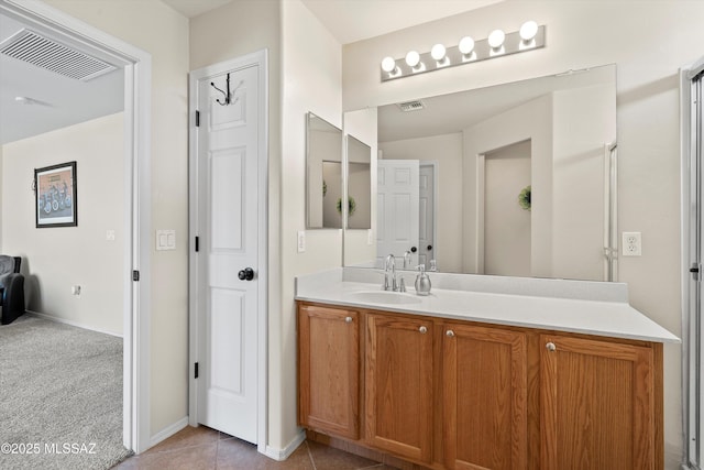 11042 W Case Way, Marana, AZ 85653 - bathroom featuring vanity, tile patterned flooring, and baseboards
