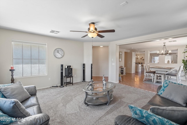 11042 W Case Way, Marana, AZ 85653 - living area featuring a chandelier, a ceiling fan, and baseboards