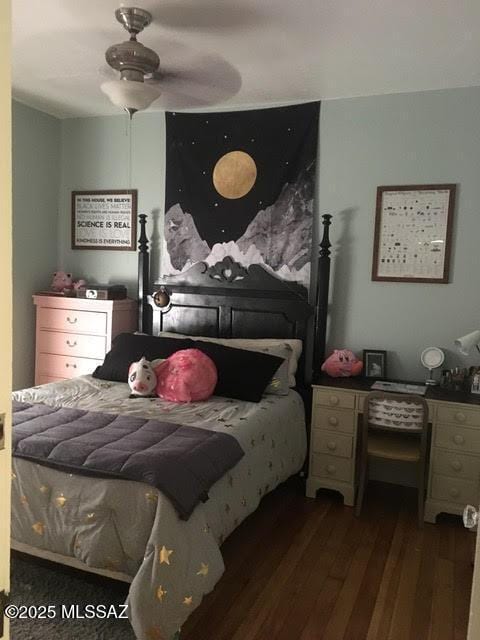bedroom featuring ceiling fan and wood finished floors