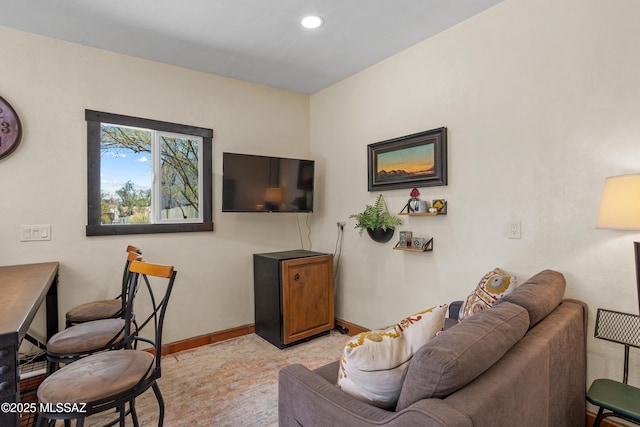 living area with baseboards and recessed lighting