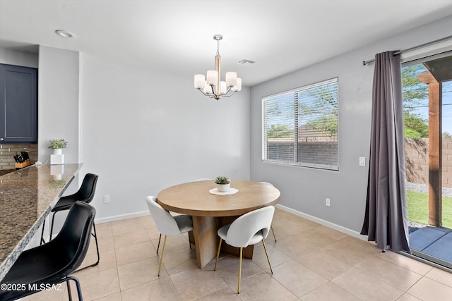 2868 N Silkie Pl, Tucson, AZ 85719 - dining space featuring light tile patterned floors, baseboards, visible vents, and a notable chandelier