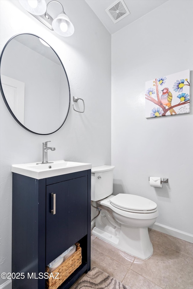 2868 N Silkie Pl, Tucson, AZ 85719 - bathroom featuring visible vents, tile patterned flooring, vanity, toilet, and baseboards