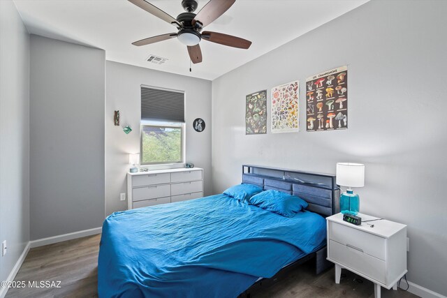2868 N Silkie Pl, Tucson, AZ 85719 - bedroom featuring visible vents, a ceiling fan, baseboards, and wood finished floors