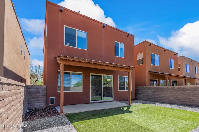 2868 N Silkie Pl, Tucson, AZ 85719 - rear view of house with a fenced backyard, a patio area, stucco siding, and a yard