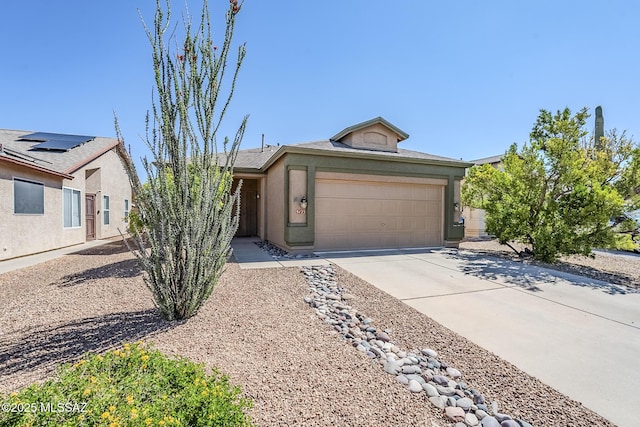 ranch-style house featuring a garage, stucco siding, and concrete driveway