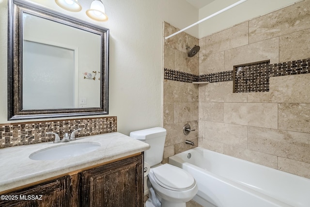 full bath featuring toilet, bathtub / shower combination, and vanity