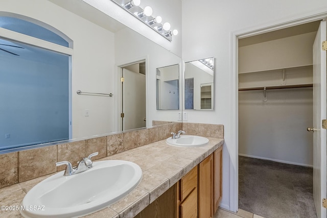 full bath featuring double vanity and a sink