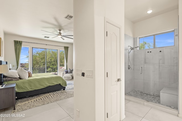 bedroom featuring light tile patterned floors, multiple windows, and visible vents