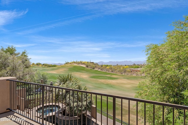 balcony with a mountain view and golf course view