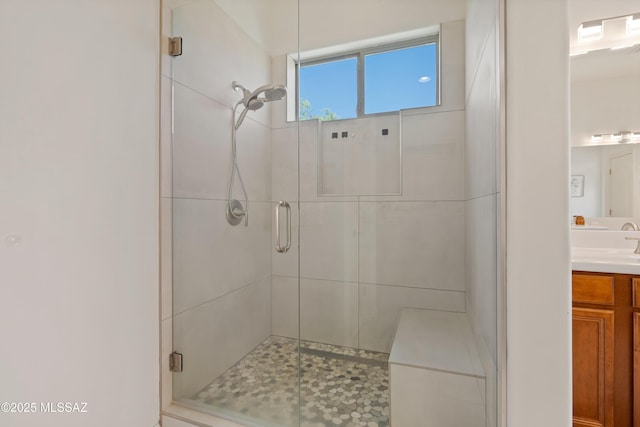 bathroom with vanity and a stall shower