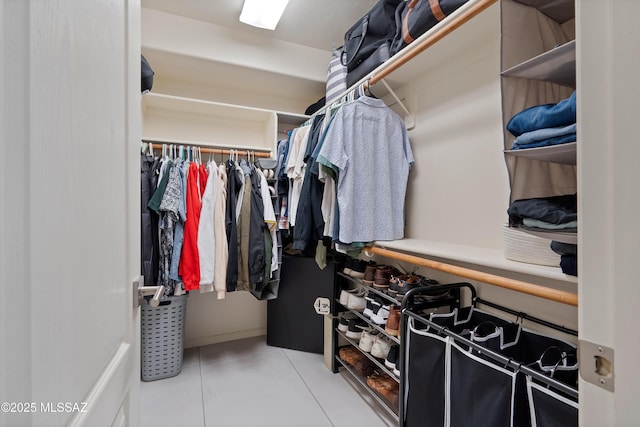 spacious closet featuring tile patterned floors
