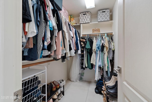 spacious closet featuring tile patterned flooring