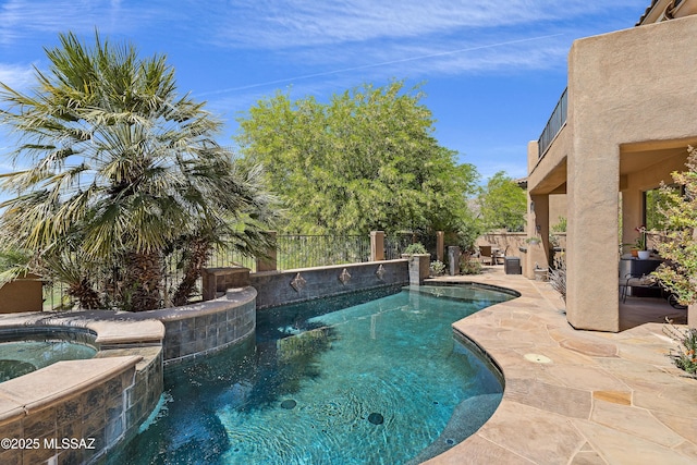 view of swimming pool featuring a patio, an in ground hot tub, a fenced in pool, and a fenced backyard